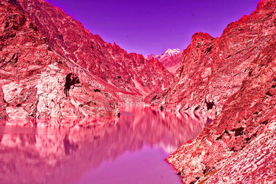 Scenic view of pink and mountains against sky