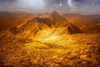 Photo montage that recreates the surface of alien planet with sky full of stars
