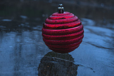 Close-up of illuminated christmas lights hanging in water