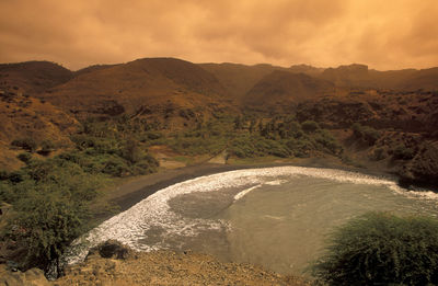 Scenic view of mountains against sky during sunset