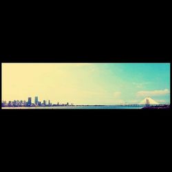 Silhouette built structures at sunset