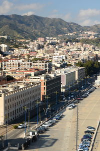 High angle view of road by buildings in city