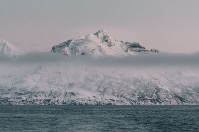 Scenic view of sea against sky during winter