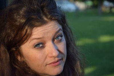Close-up portrait of woman in park