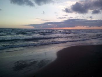 Scenic view of beach against sky during sunset