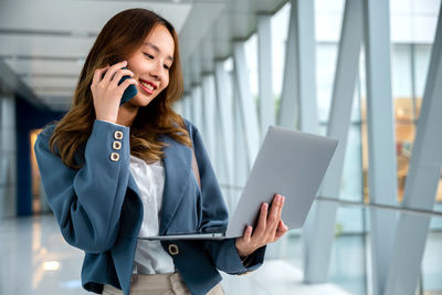 Young woman using mobile phone