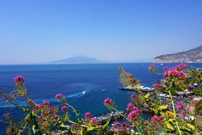 Scenic view of sea against clear blue sky