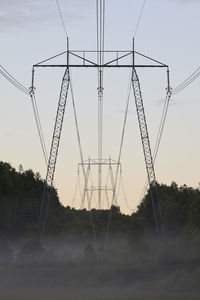 Low angle view of electricity pylon