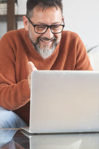 Man using laptop at home