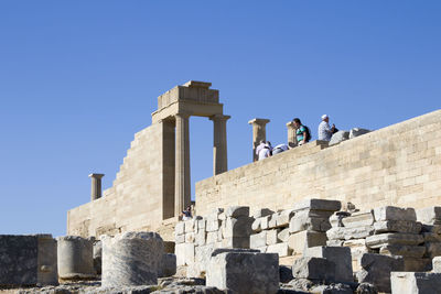 Low angle view of historical building against blue sky