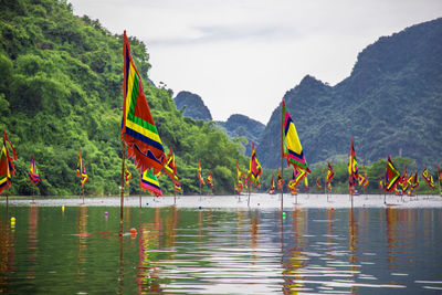 Scenic view of lake and mountains against sky