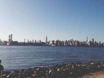 View of cityscape against blue sky