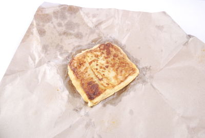 High angle view of bread on white background