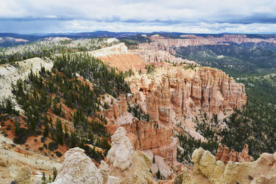 Rock formations at bryce canyon national park against cloudy sky