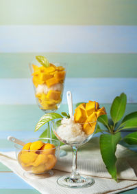 Close-up of fruits on glass table