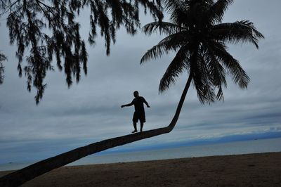 Man on beach against sky