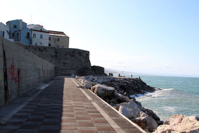  the arm of the port. in the background the houses of the historic center with the walls