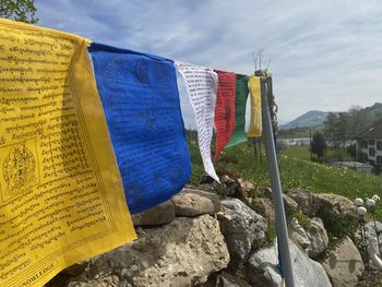 Clothes drying on rock against sky