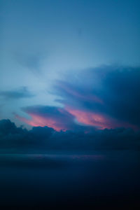 Scenic view of sea against dramatic sky