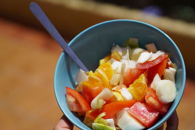 High angle view of chopped fruits in bowl on table