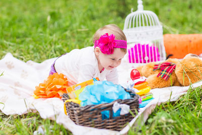 Cute girl with toy on field