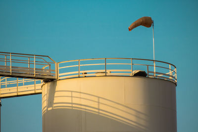 Low angle view of factory against clear sky