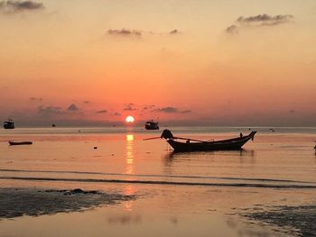 Scenic view of sea at sunset