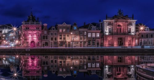 Illuminated buildings in city at night