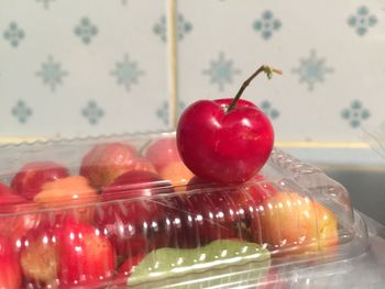 Close-up of apples in glass on table