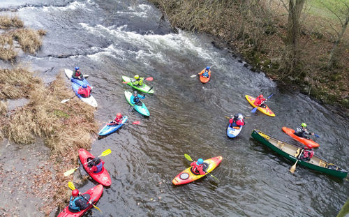 High angle view of people by boats in water