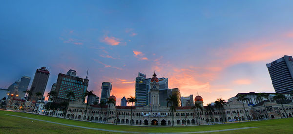 View of buildings against sky at sunset