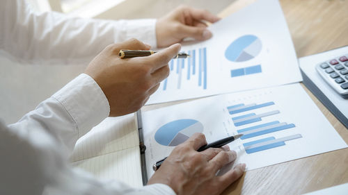 High angle view of business people working on table