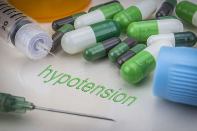 High angle view of multi colored bottles on table