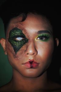 Close-up portrait of young man with make-up