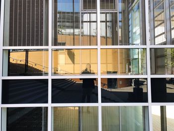 Reflection of buildings on glass window