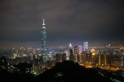 Illuminated buildings in city at night