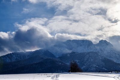 Scenic view of mountains against sky during winter