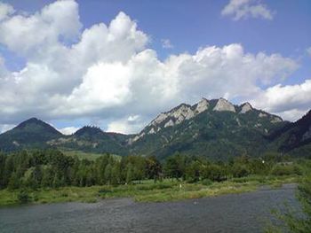 Scenic view of mountains against cloudy sky