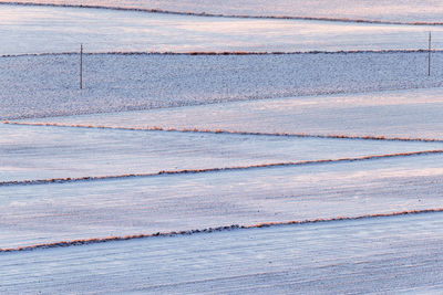 Winter fields in the countryside with a power line