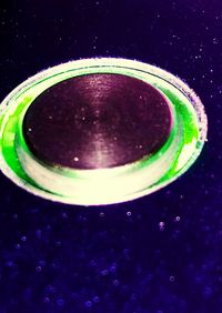 Close-up of glass over black background