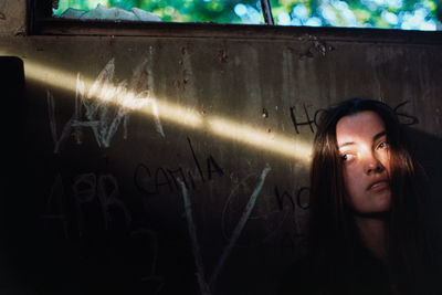 Portrait of young woman in mirror