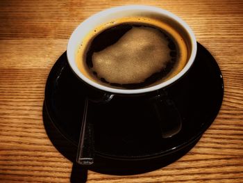 High angle view of coffee cup on table