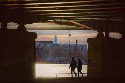 Silhouette of man with building in background