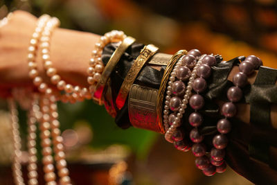 Cropped hand of woman with jewelry