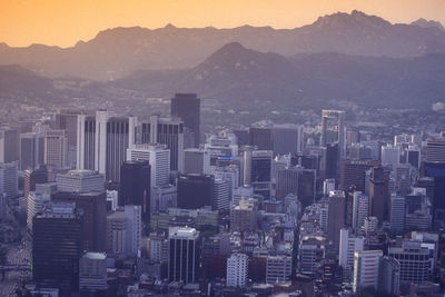 High angle view of buildings in city against sky