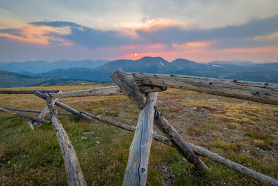 Scenic view of field against sky during sunset