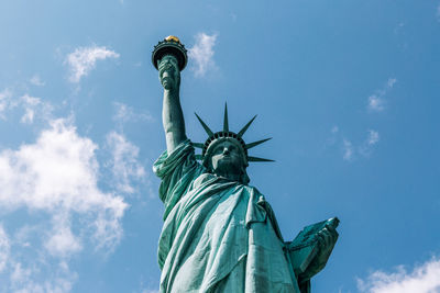 Statue of liberty against blue sky