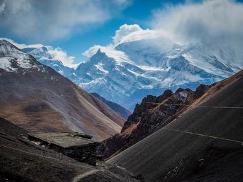 Scenic view of snowcapped mountains against sky