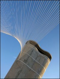 Low angle view of one world trade center against clear blue sky