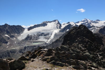 Aerial view of snowcapped mountains against sky